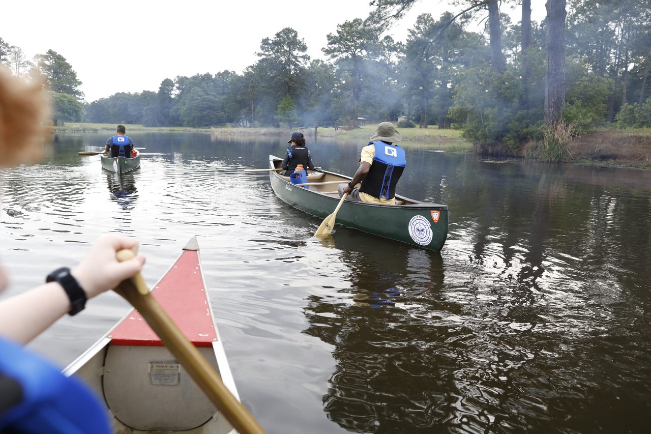Paddling team works together.