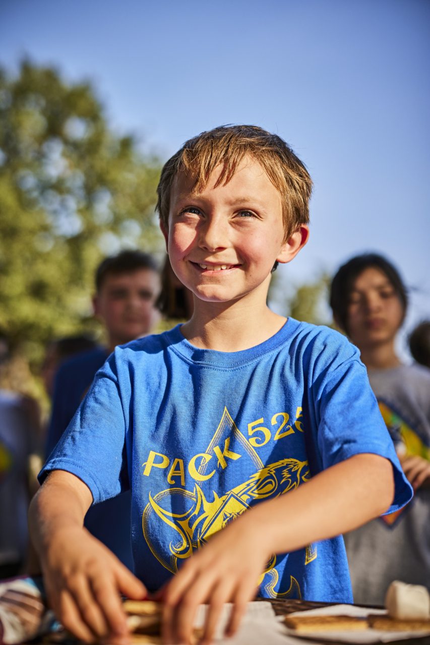 Gathered around the campfire at dusk.