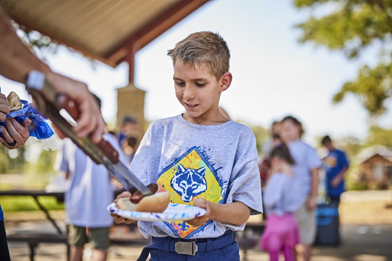 Roasting marshmallows over the fire.