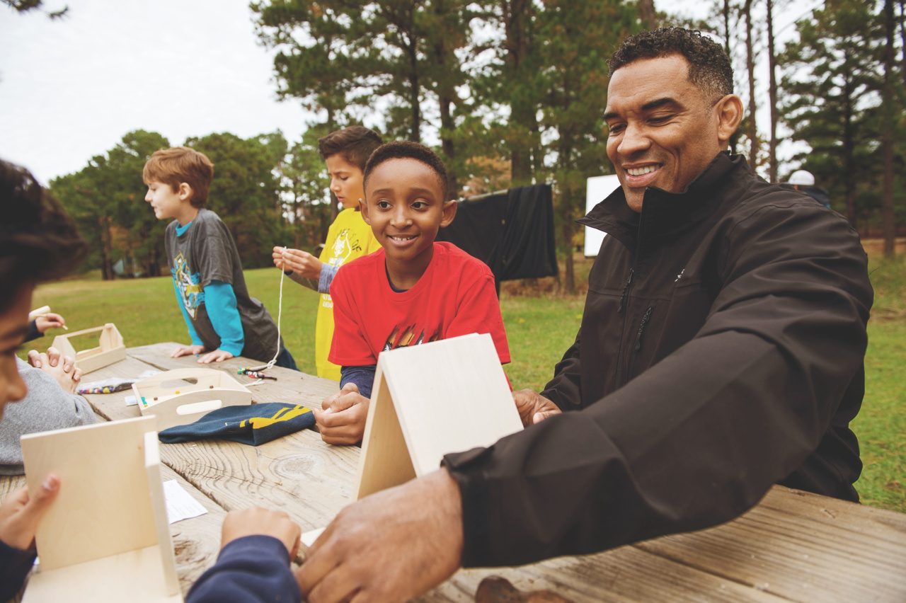 Crafts on an outdoor camp table.