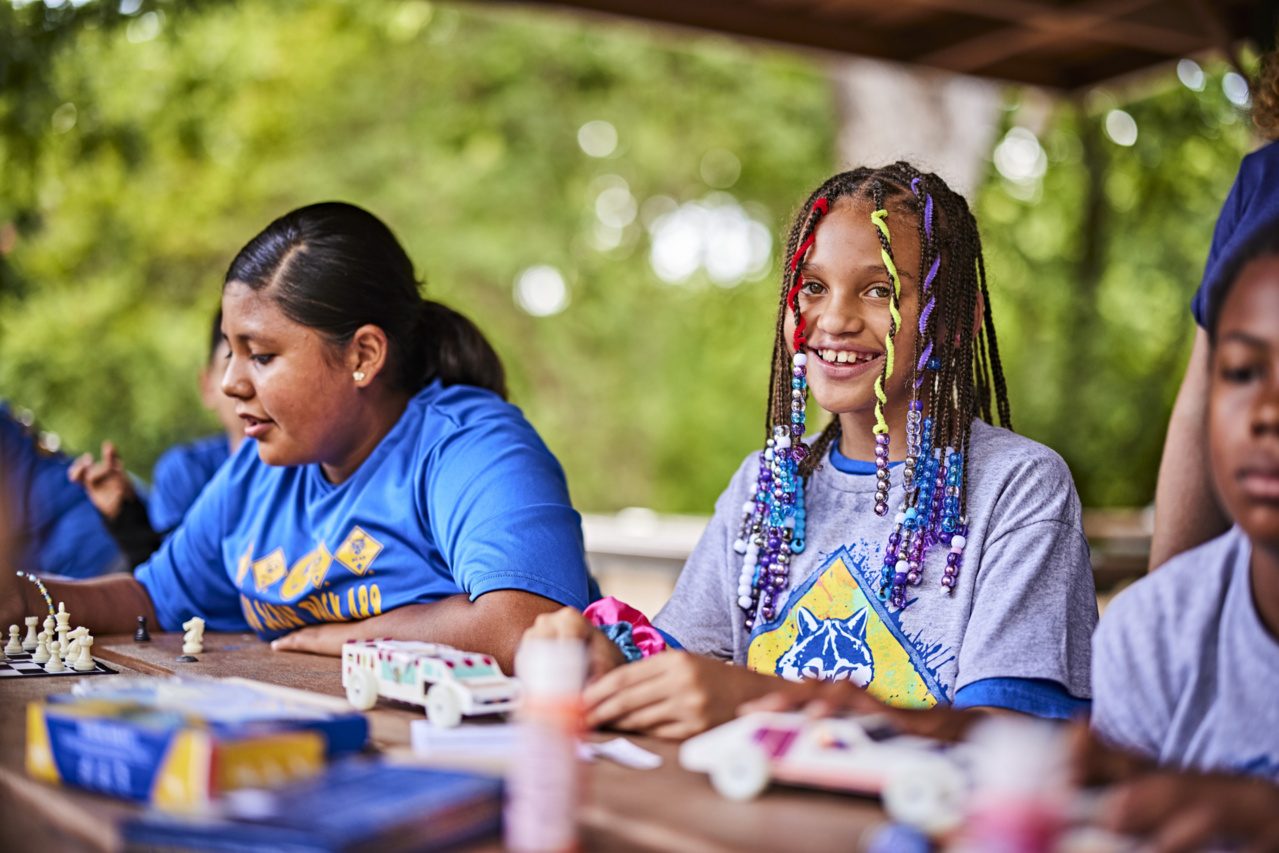 Cubs decorate cars at a derby workshop.